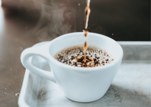 Hamilton Beach Flexbrew Review, photo of a white coffee mug with water being poured into it