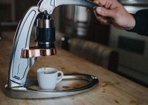 Photo of gray flair espresso maker being used to make a cup of espresso