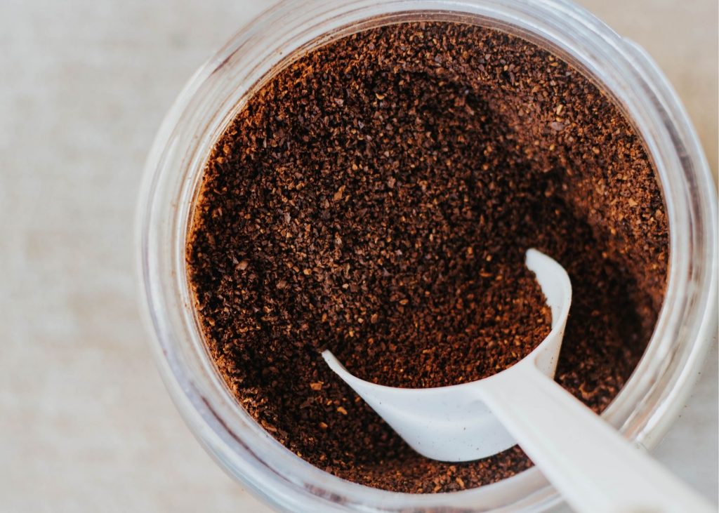 best instant coffee, photo of a container of instant coffee with a white spoon